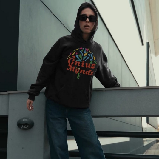 Black Triumph hoodie by shopgnius featuring a front pocket, hood, and stylish logo, displayed on a hanger.